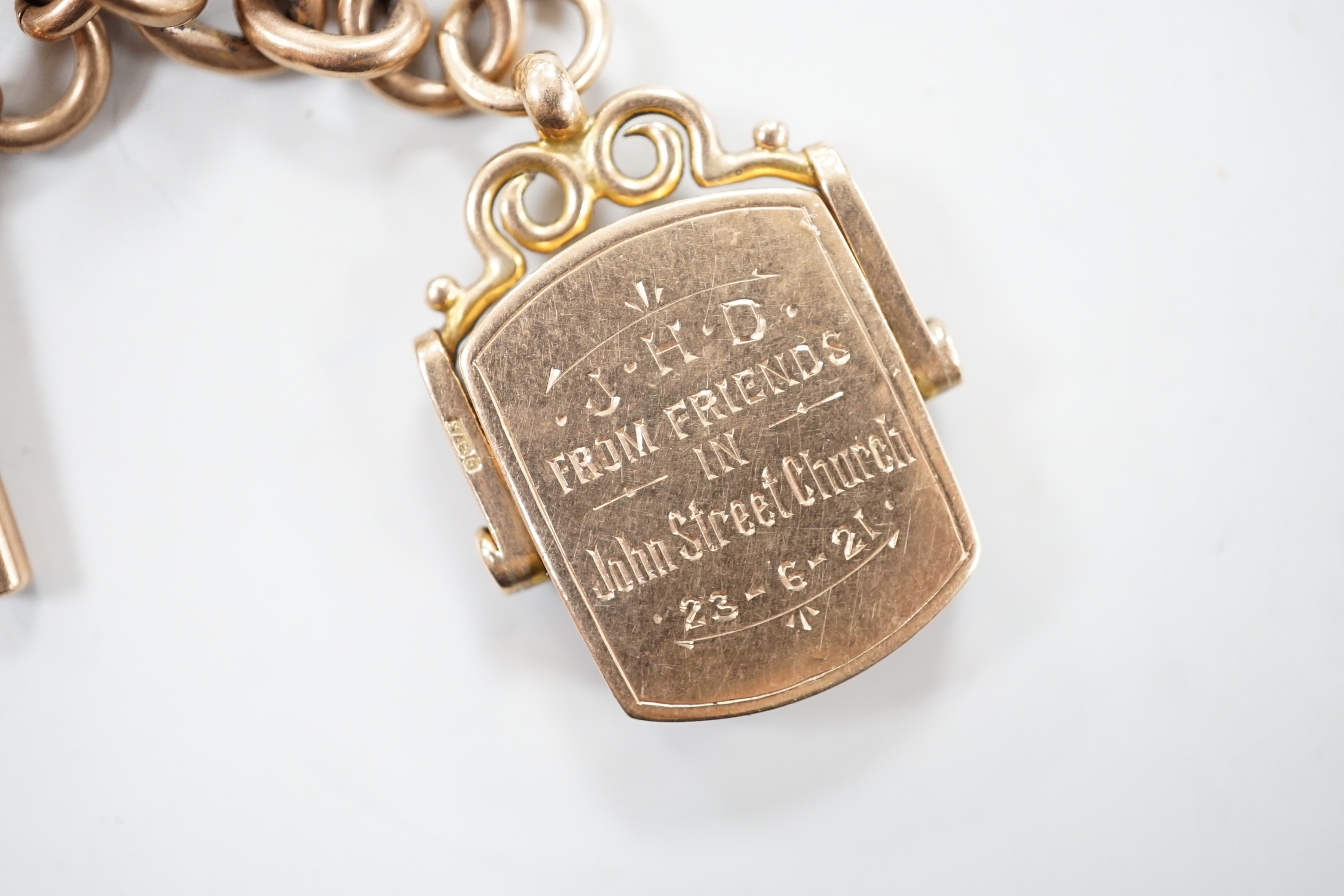 An Edwardian 9ct gold albert, hung with a bloodstone set swivelling fob, 38cm, gross weight 51.1 grams.